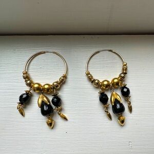 Beautiful gold hoop earrings with black crystal beads